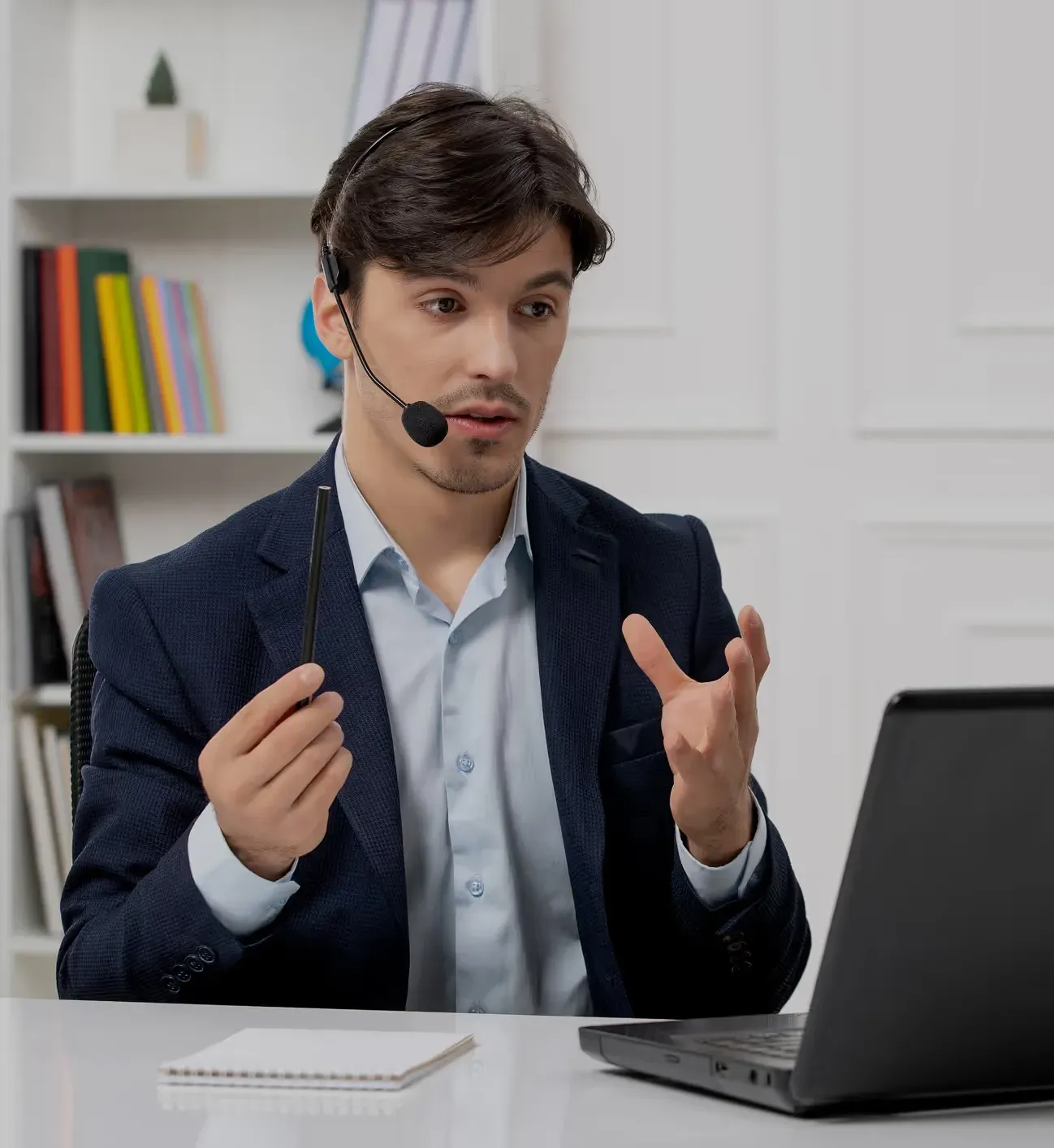 A colleague on a support call at their desk